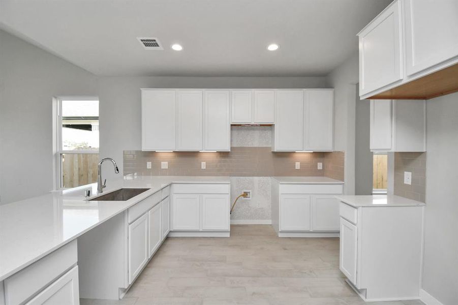 This generously spacious kitchen is a dream realized!