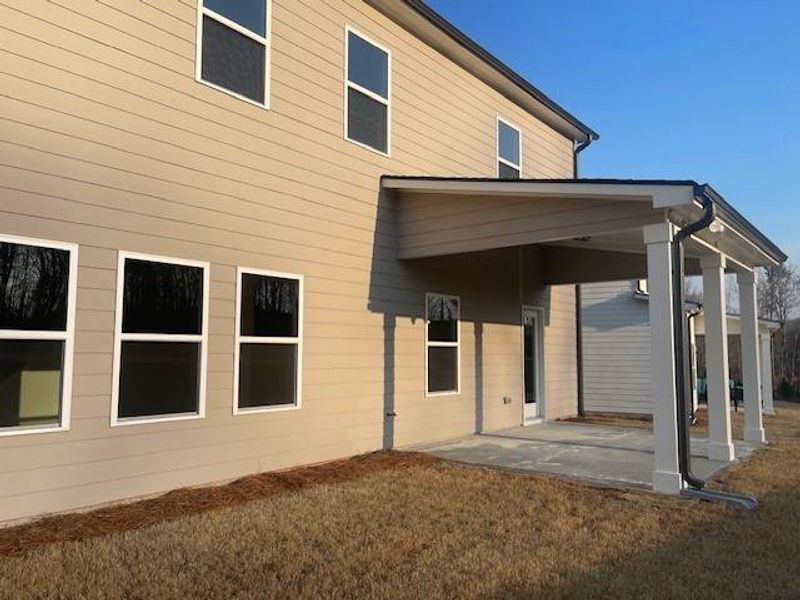 Exterior details and patio area of a home in Ponderosa Farms Estates, Gainesville (Image 32).