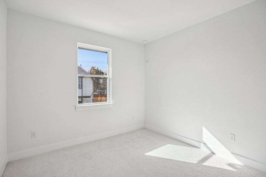 Spacious, unfurnished interior of a new home in Koenig Townhomes, Austin (Image 23).