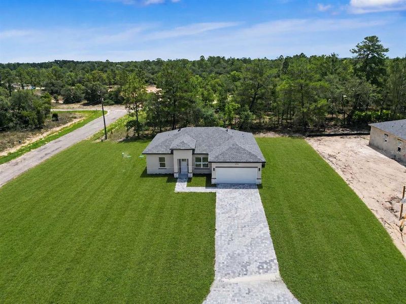 Front exterior of a new home in , Citrus Springs, FL, highlighting curb appeal (Image 21).