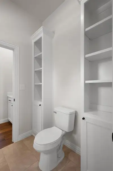 Bathroom featuring light tile patterned flooring and a closet