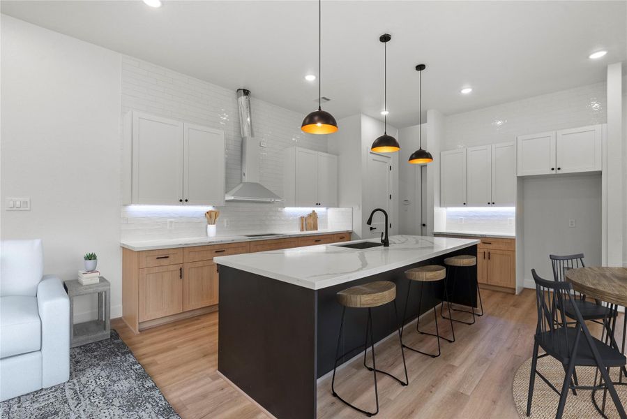 The kitchen island doubles as a breakfast bar *Virtually Staged to Illustrate Potential* The kitchen island doubles as a breakfast bar *Virtually Staged to Illustrate Potential*