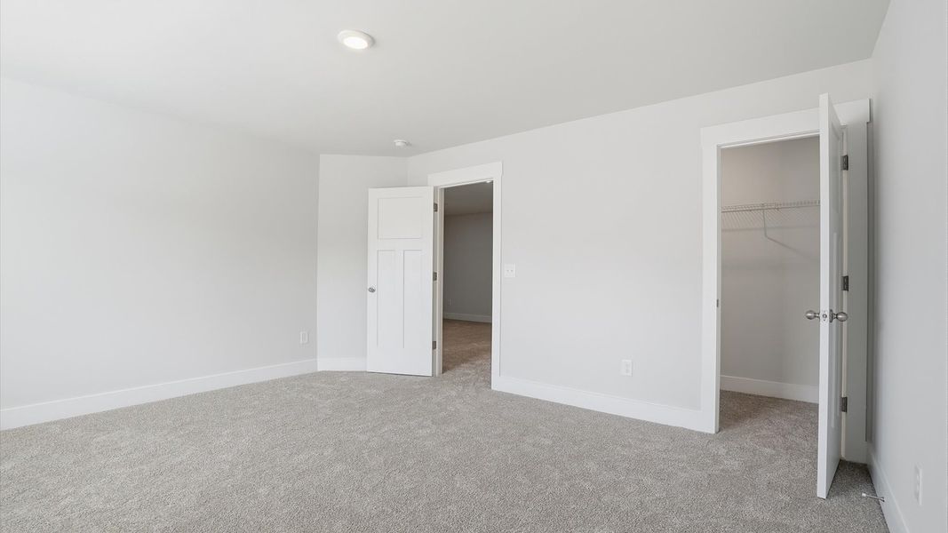 Secondary bedroom with spacious walk-in closet and thoughtful design in Anderson, SC