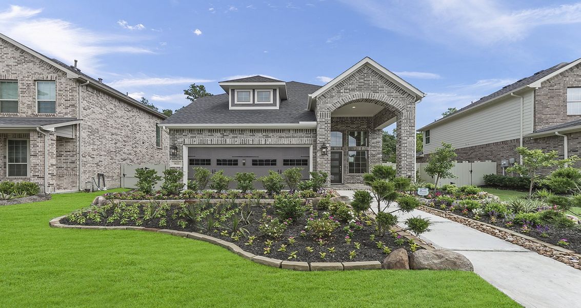 Front exterior of a new home in Wood Leaf Reserve, Tomball, TX, highlighting curb appeal (Image 22).