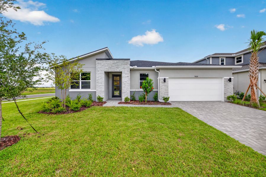 Front exterior of a new home in Crosswind Ranch, Parrish, FL, highlighting curb appeal (Image 1). Front exterior of a new home in Crosswind Ranch, Parrish, FL, highlighting curb appeal (Image 1).
