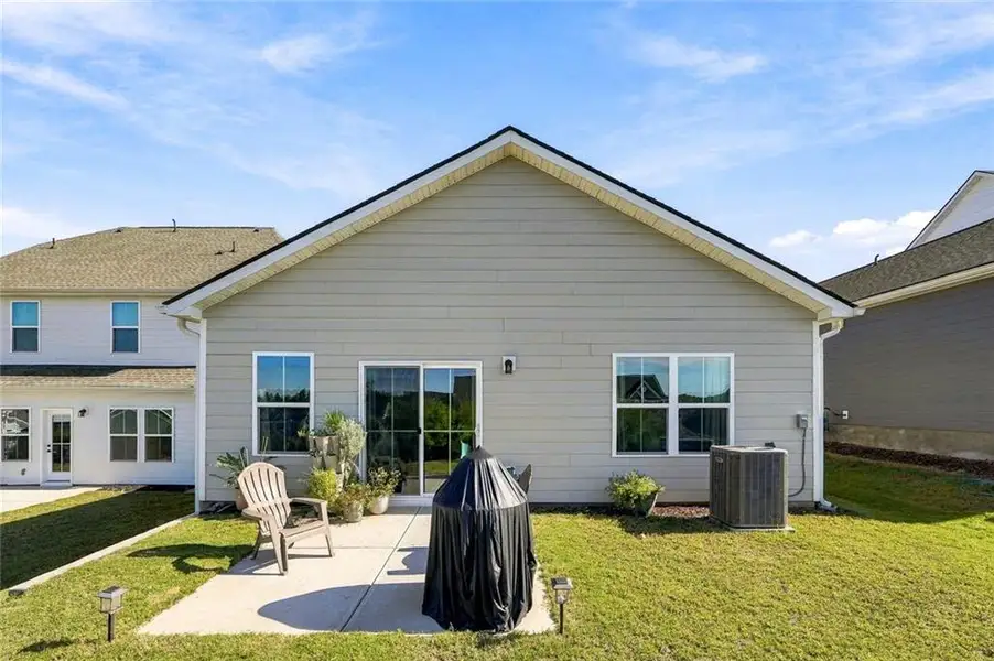 Front exterior of a new home in , Hoschton, GA, highlighting curb appeal (Image 20).