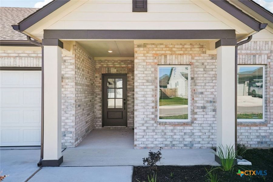 Exterior details and patio area of a home in Village at Three Oaks, Seguin (Image 3).