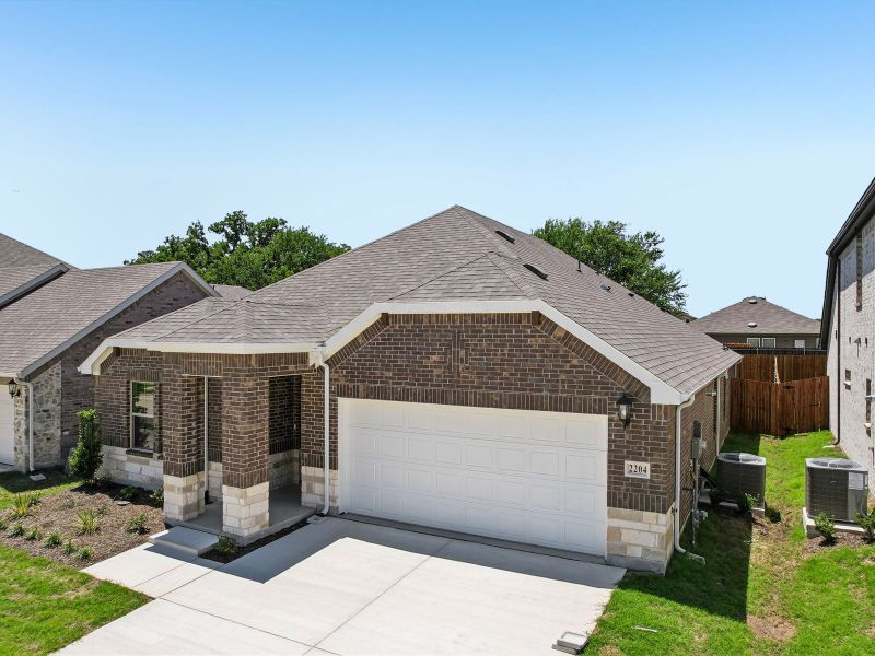 Front exterior of a new home in Stella Hills, Denton, TX, highlighting curb appeal (Image 22). Front exterior of a new home in Stella Hills, Denton, TX, highlighting curb appeal (Image 22).