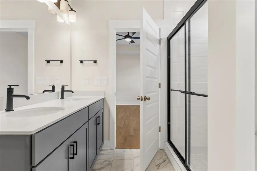 This modern bathroom features a double vanity and