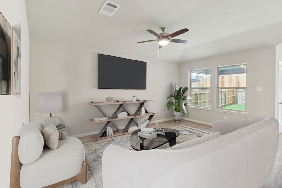 Virtually staged living room in the Callaghan floorplan at a Meritage Homes community.