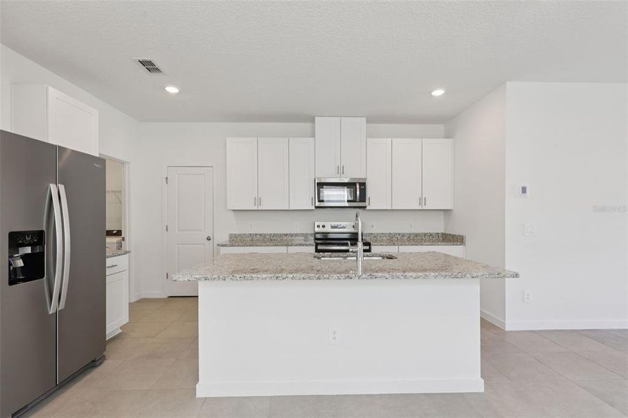 Furnished interior view inside a new home in Flagler Village - Classic Series, Palm Coast (Image 7).