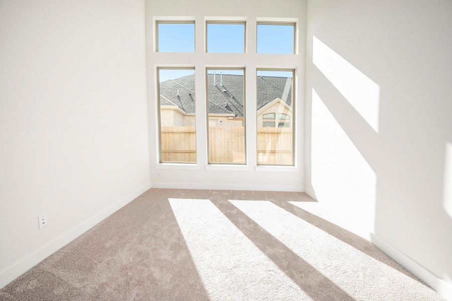 This sizable secondary bedroom offers plenty of space and comfort, featuring ample natural light and a versatile layout. Perfect for guests, family members, it provides a peaceful retreat with elegant design and thoughtful details throughout.