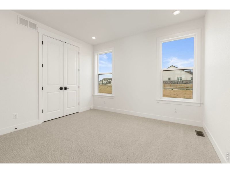 Spacious, unfurnished interior of a new home in RainDance, Windsor (Image 27).