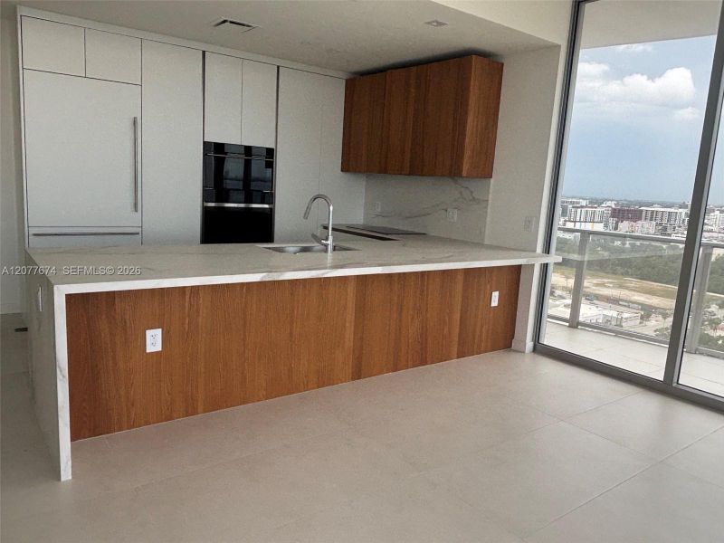 Italian-Style Kitchen with Waterfall Island