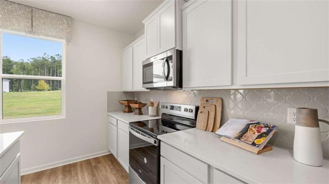Furnished interior view inside a new home in Oakchase at Hampton, Hampton (Image 10).