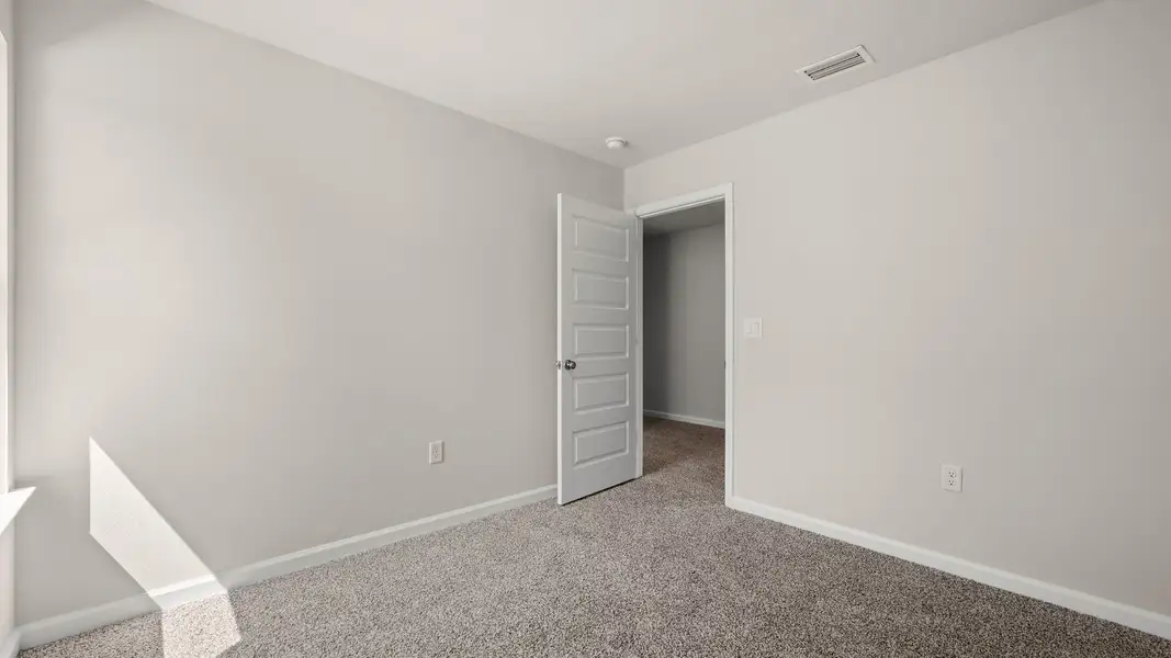 Representative unfurnished interior of a home built from the The Canmore by D.R. Horton in Salt Pines, Port Saint Joe (Image 31).