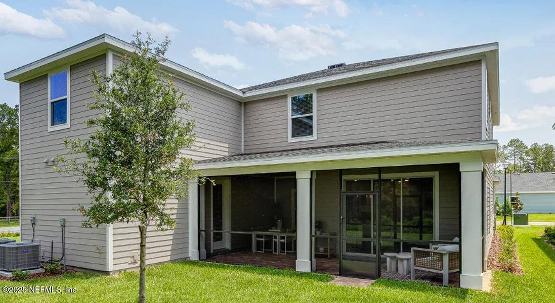 Front exterior of a new home in Russell Retreat, Green Cove Springs, FL, highlighting curb appeal (Image 2).