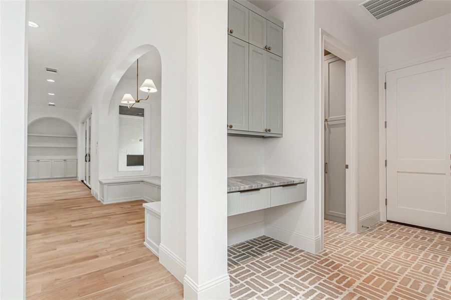 Mudroom area with built in desk