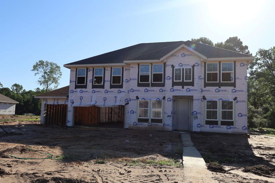Two story home with 5 bedrooms, 4.5 baths, and 4 car tandem garage.