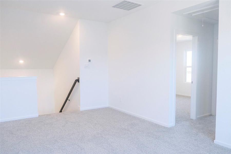 Upstairs loft / flex space leading downstairs.