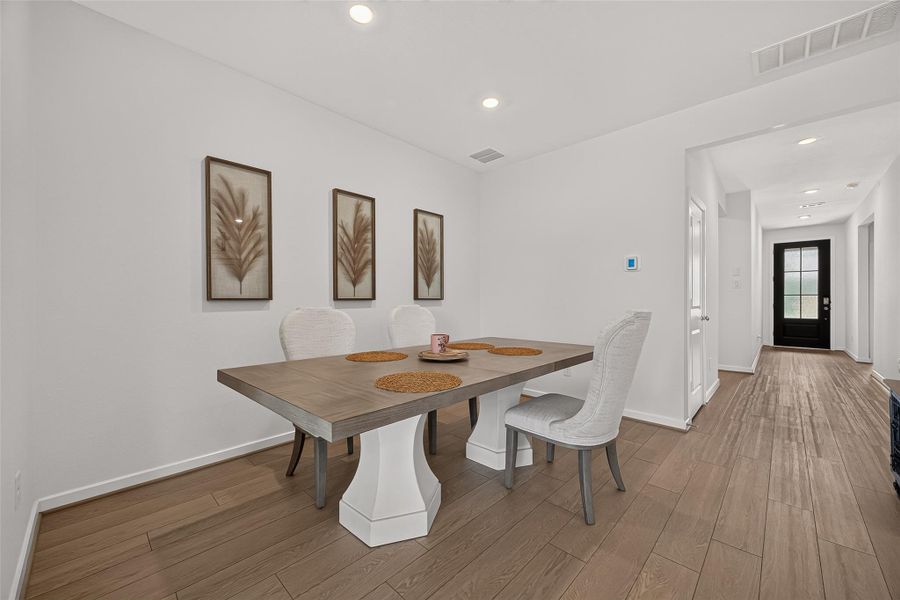 An alternative view of the dining area facing the front entrance.