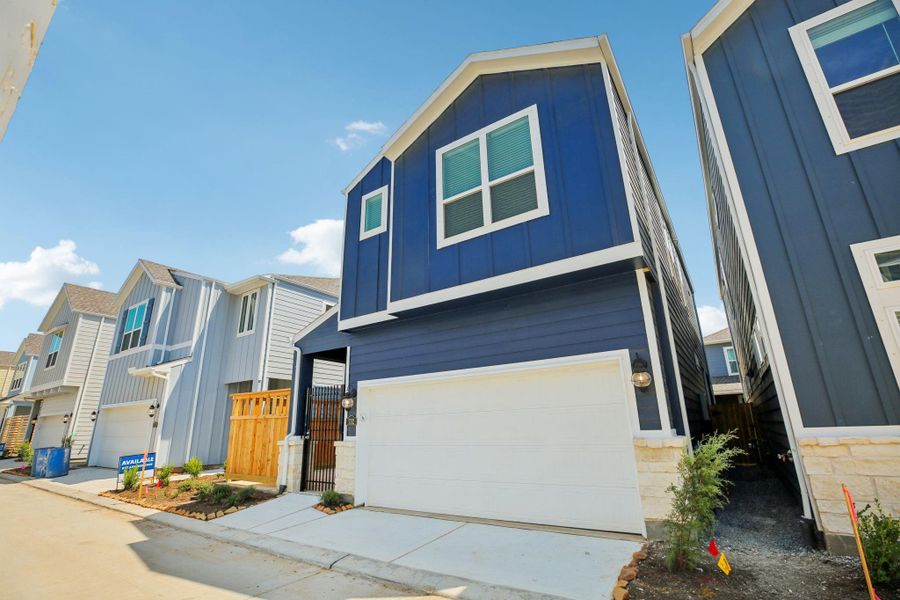 Front exterior of a new home in Kemah Crossing - Luxe Series, Kemah, TX, highlighting curb appeal (Image 1). Front exterior of a new home in Kemah Crossing - Luxe Series, Kemah, TX, highlighting curb appeal (Image 1).