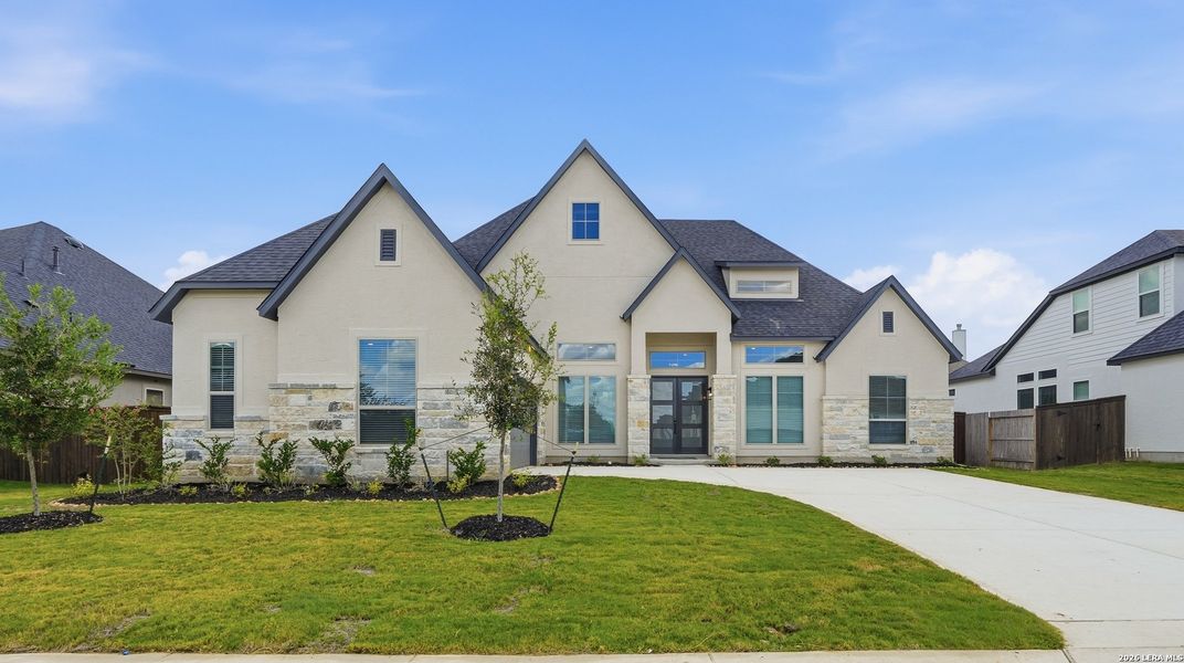 Front exterior of a new home in Mesa Western, Cibolo, TX, highlighting curb appeal (Image 27). Front exterior of a new home in Mesa Western, Cibolo, TX, highlighting curb appeal (Image 27).