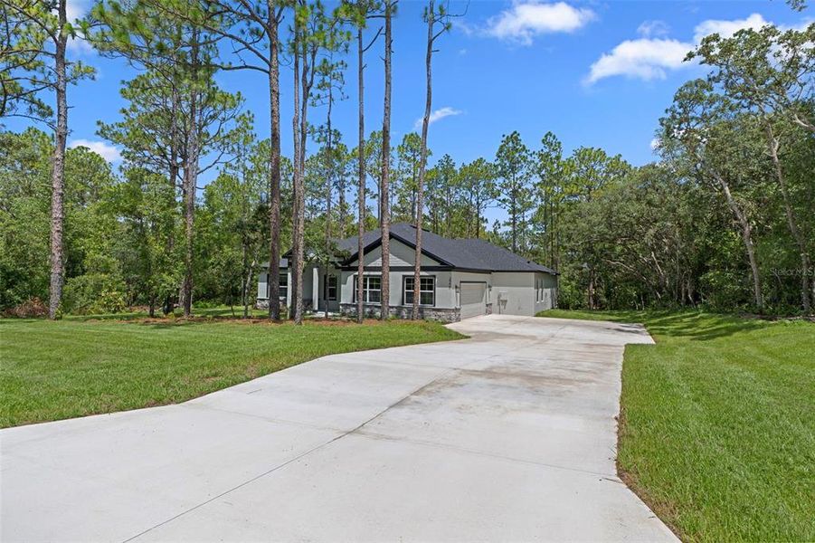 Front exterior of a new home in , Hernando, FL, highlighting curb appeal (Image 29). Front exterior of a new home in , Hernando, FL, highlighting curb appeal (Image 29).