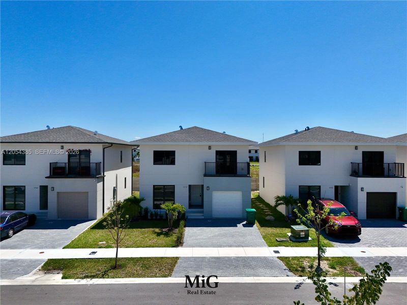 Front exterior of a new home in , Florida City, FL, highlighting curb appeal (Image 2). Front exterior of a new home in , Florida City, FL, highlighting curb appeal (Image 2).