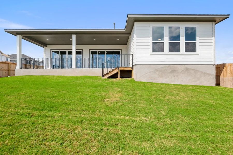 Exterior details and patio area of a home in Capitol Collection at Lariat, Liberty Hill (Image 22).