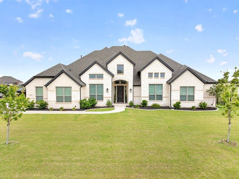 Front exterior of a new home in Heritage, McLendon-Chisholm, TX, highlighting curb appeal (Image 1). Front exterior of a new home in Heritage, McLendon-Chisholm, TX, highlighting curb appeal (Image 1).