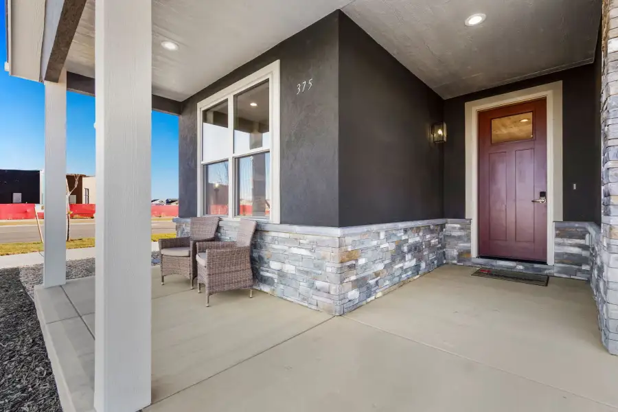 Exterior details and patio area of a home in The Courtyards at Lupton Village, Fort Lupton (Image 23).