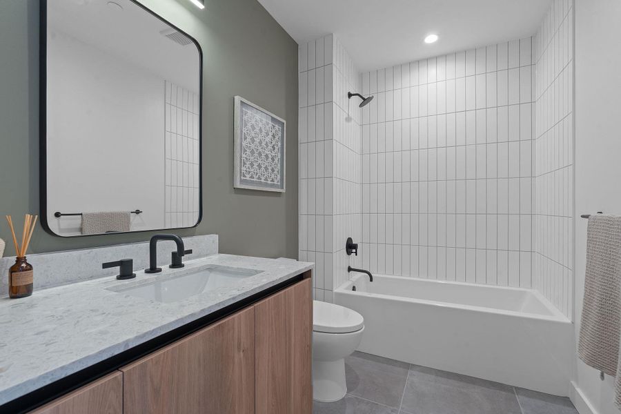 Representative Photo. Spacious secondary bathroom with full sized bath and