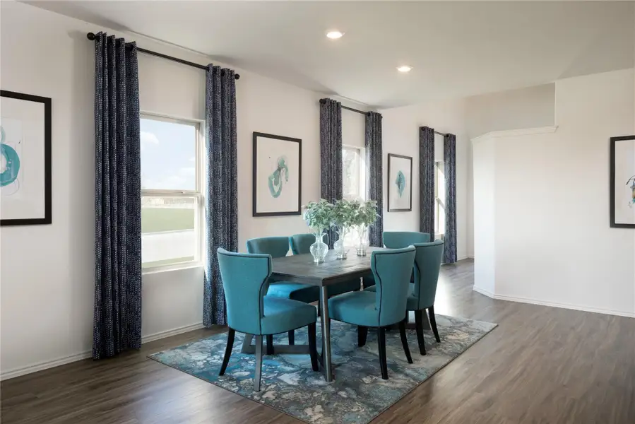 Dining room featuring plenty of natural light, dark wood-type flooring, and recessed lighting Dining room featuring plenty of natural light, dark wood-type flooring, and recessed lighting