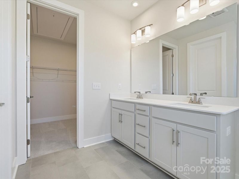 En Suite Primary Bath With Dual Vanity and Loads of Storage.