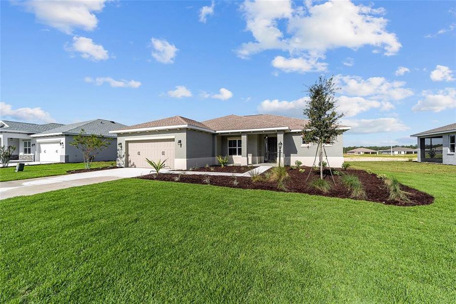 Front exterior of a new home in On Top of the World Communities, Ocala, FL, highlighting curb appeal (Image 19).
