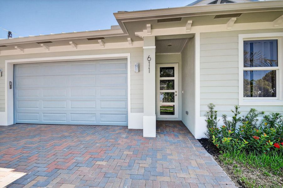 Front exterior of a new home in , Jupiter, FL, highlighting curb appeal (Image 29).
