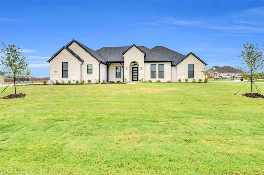 Front exterior of a new home in Springside Estates II, Waxahachie, TX, highlighting curb appeal (Image 19). Front exterior of a new home in Springside Estates II, Waxahachie, TX, highlighting curb appeal (Image 19).