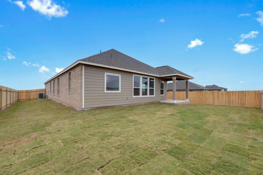 Exterior details and patio area of a home in Mustang Valley, Manor (Image 21).