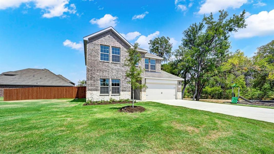 Front exterior of a new home in Bluff Springs, Ferris, TX, highlighting curb appeal (Image 18). Front exterior of a new home in Bluff Springs, Ferris, TX, highlighting curb appeal (Image 18).