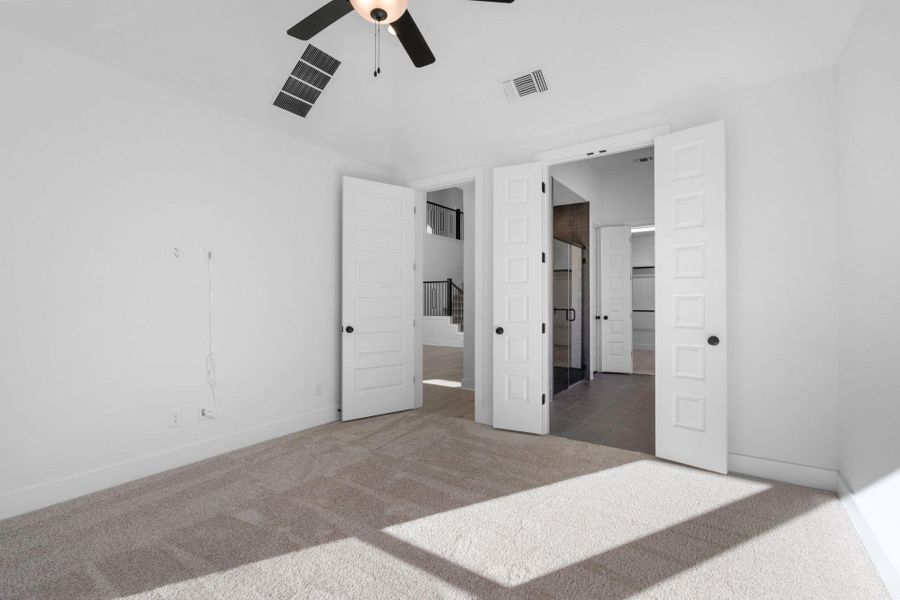 Primary Bedroom with elevated ceiling