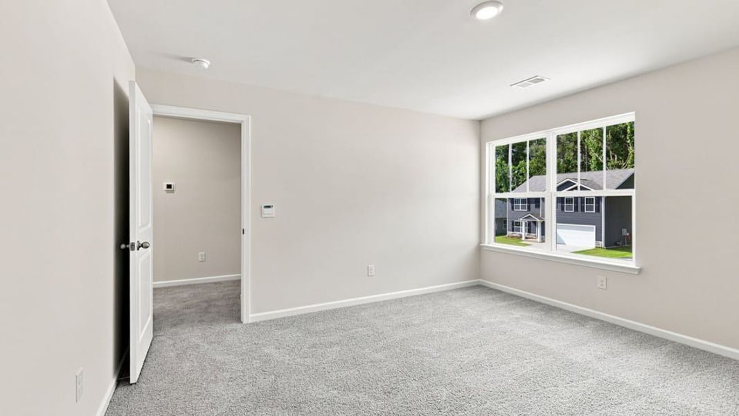 Spacious, unfurnished interior of a new home in Bentley Park, Greenwood (Image 28).