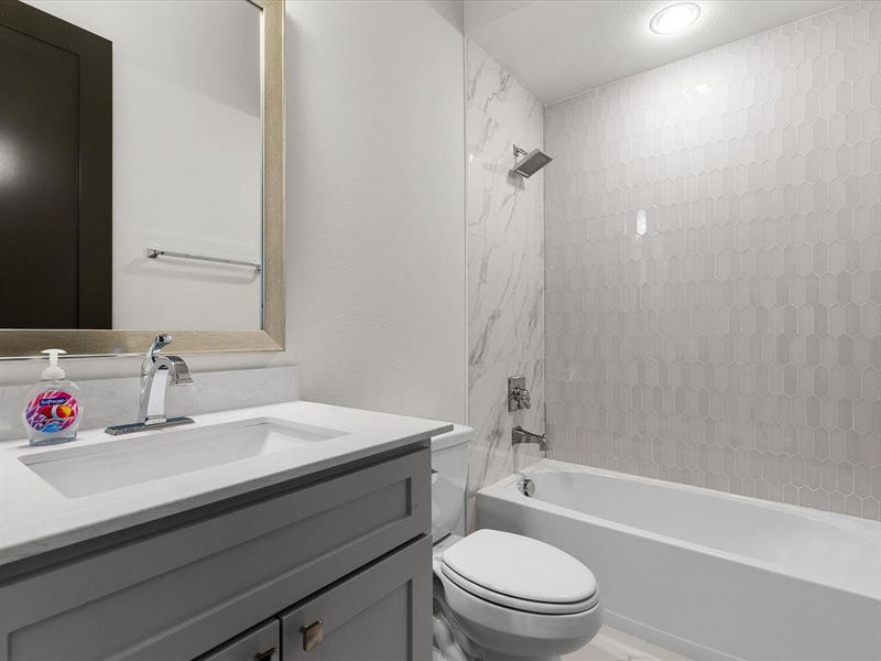 Full bathroom with washtub / shower combination and vanity Full bathroom with washtub / shower combination and vanity