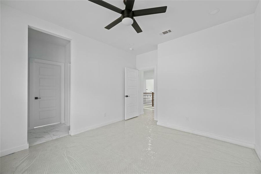 Spare room featuring ceiling fan and baseboards Spare room featuring ceiling fan and baseboards