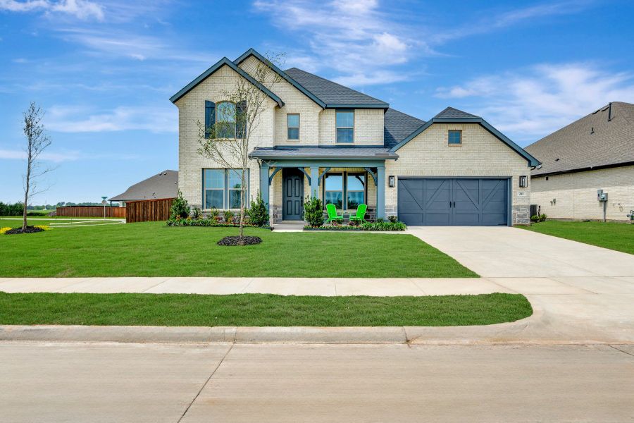 Front exterior of a new home in Myrtle Creek, Waxahachie, TX, highlighting curb appeal (Image 2). Front exterior of a new home in Myrtle Creek, Waxahachie, TX, highlighting curb appeal (Image 2).