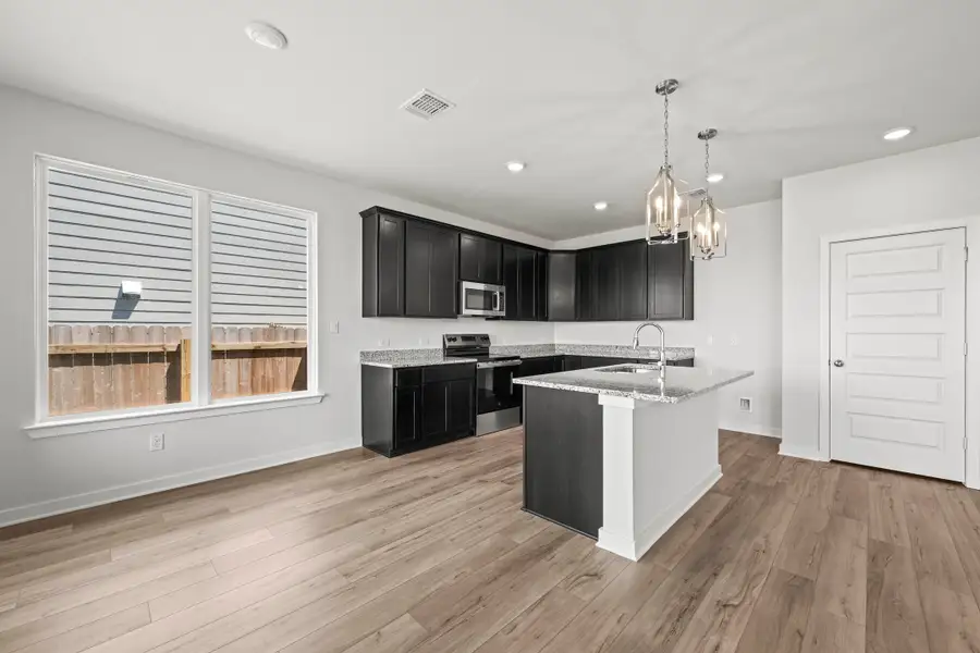Furnished interior view inside a new home in Rancho San Gabriel, Georgetown (Image 5).