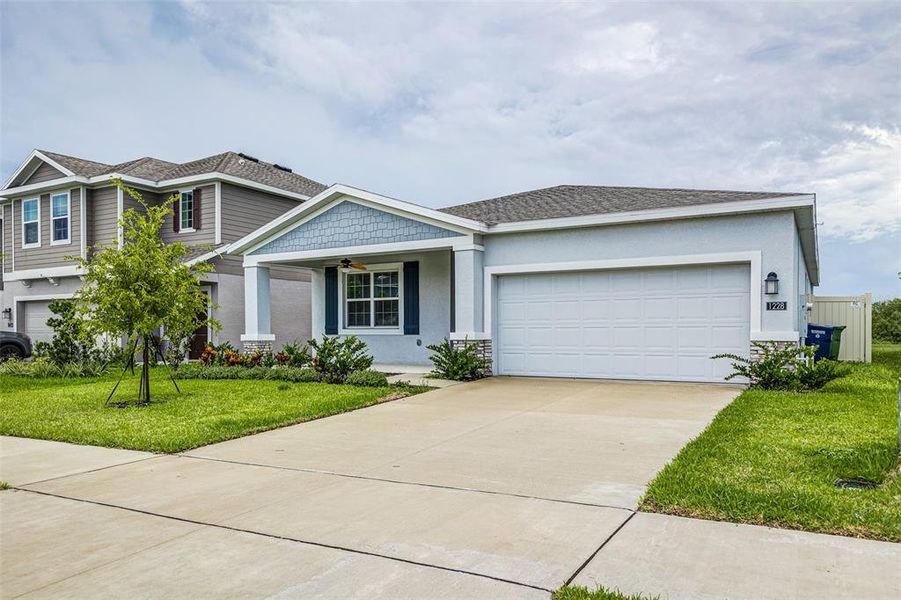 Front exterior of a new home in , Winter Haven, FL, highlighting curb appeal (Image 1). Front exterior of a new home in , Winter Haven, FL, highlighting curb appeal (Image 1).