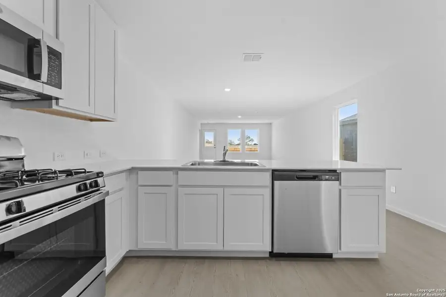 Furnished interior view inside a new home in Randolph Crossing: Cottage Collection, Converse (Image 8).