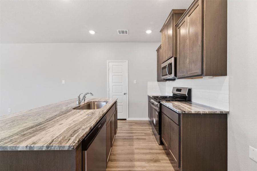 Furnished interior view inside a new home in Sunterra, Katy (Image 10).