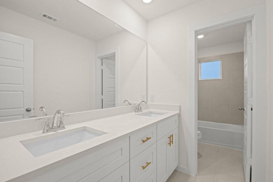 Furnished interior view inside a new home in Creekhaven, Iowa Colony (Image 9).